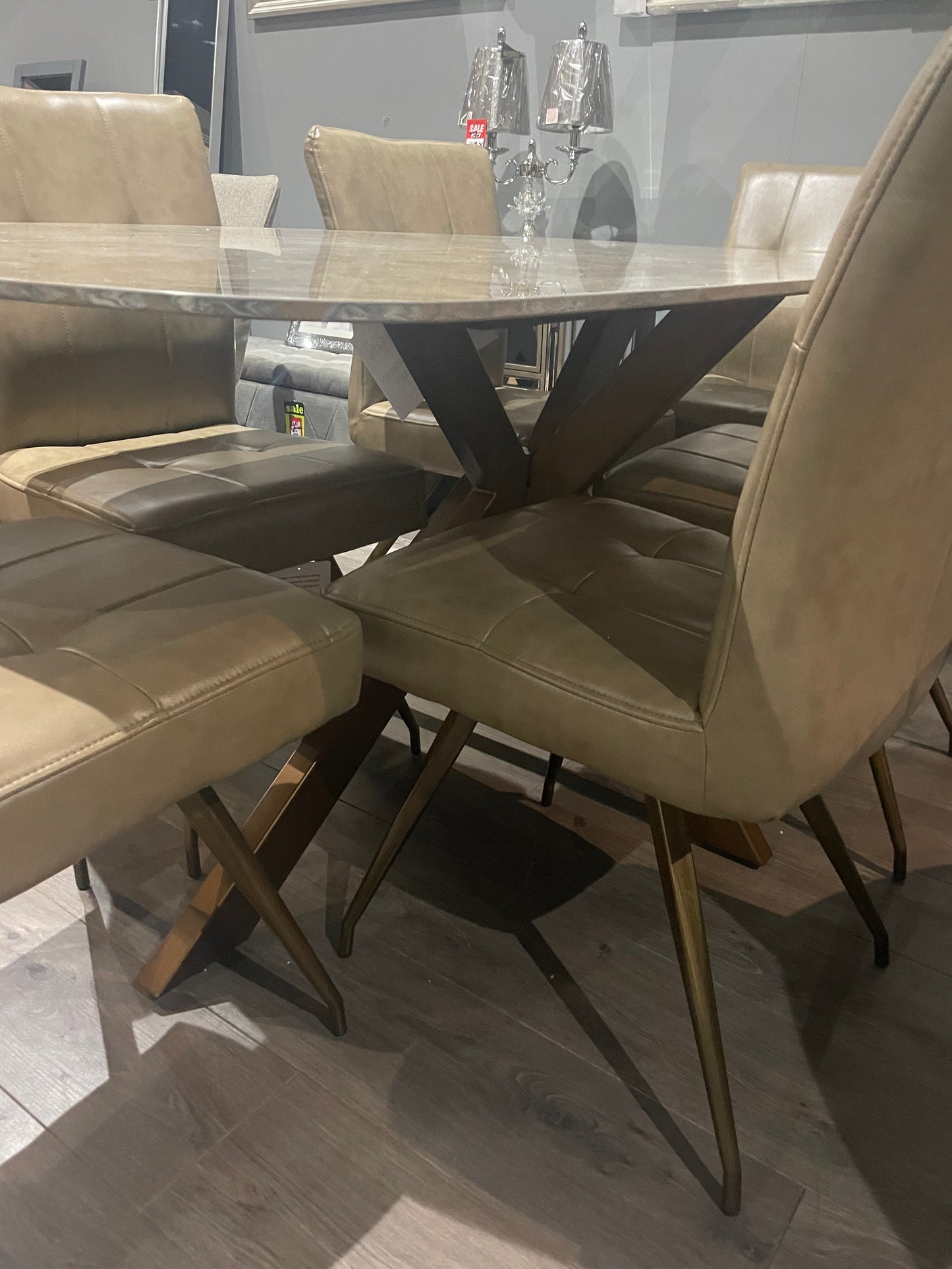 Sammy Marble look Large dining table with brass spider leg discontinued ?