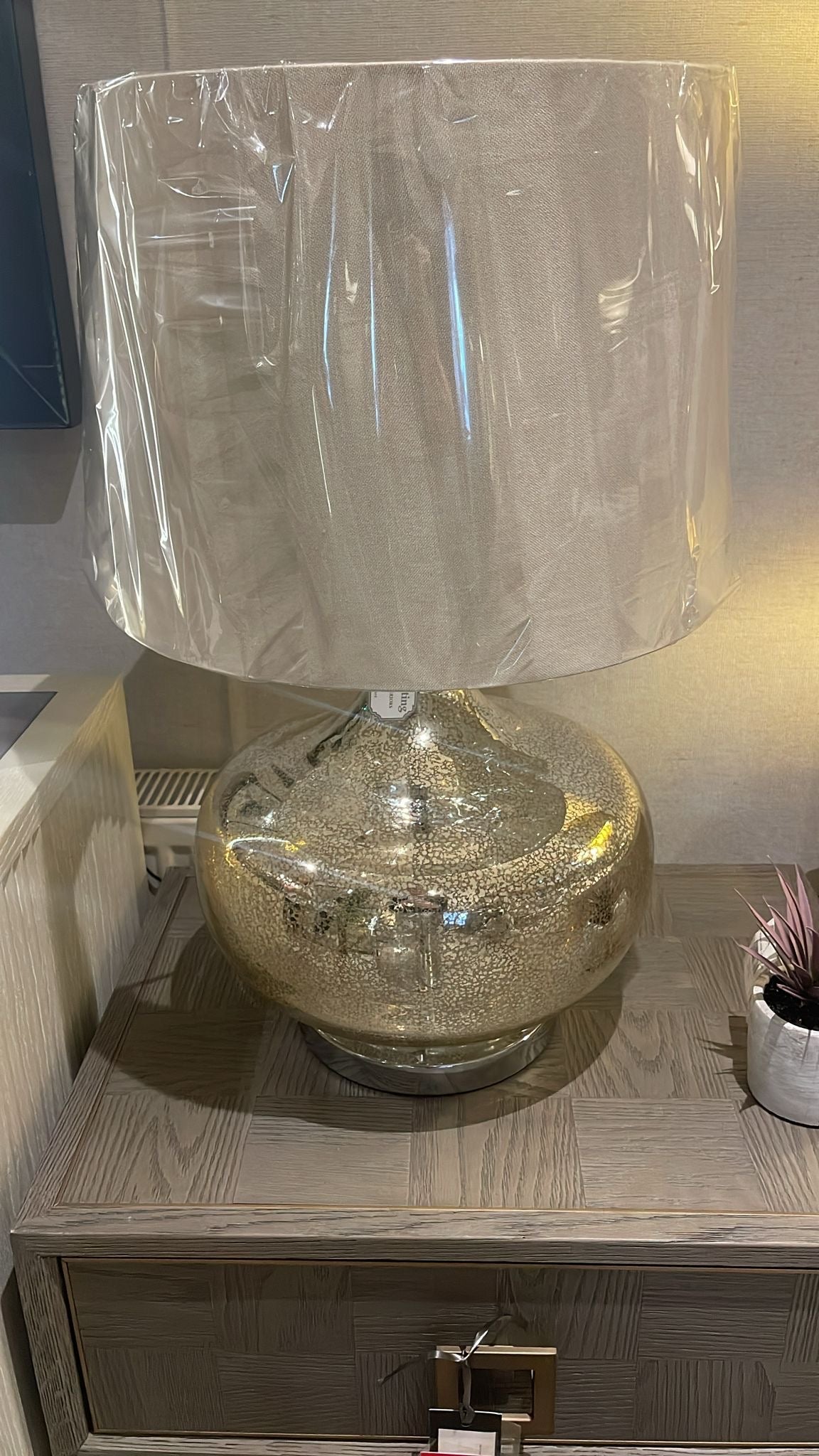 Hill Table lamp with shade in a gentle gold finish.