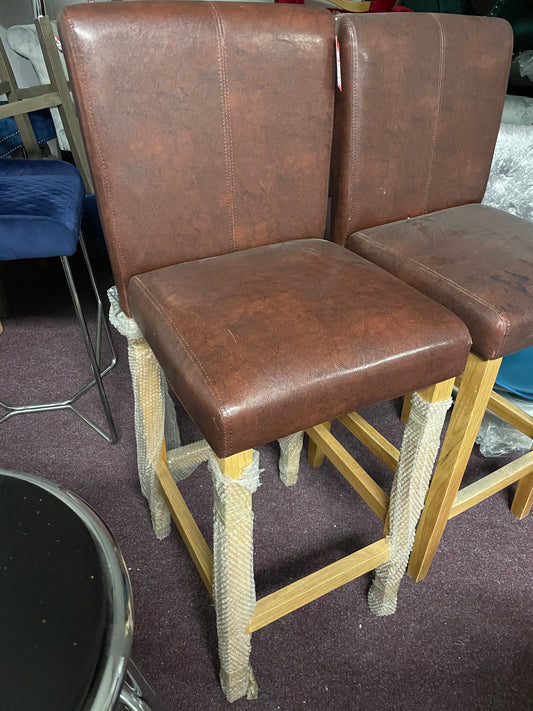 2 leather and oak colour bar stools Ex display  unwrapped so for collection only