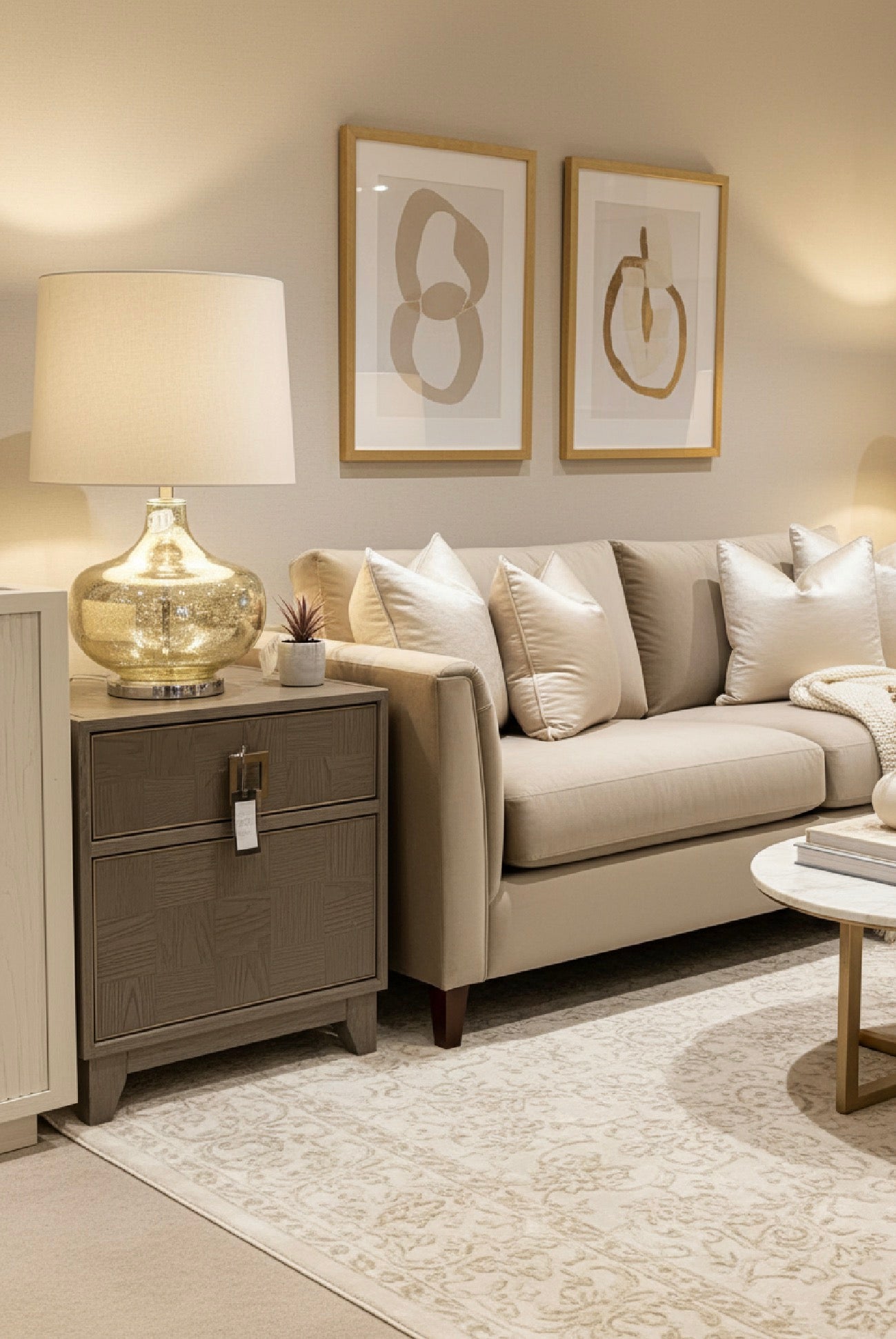 Hill Table lamp with shade in a gentle gold finish.