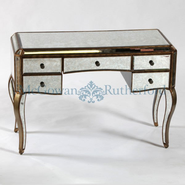 Antiqued glass dressing table with gold trim