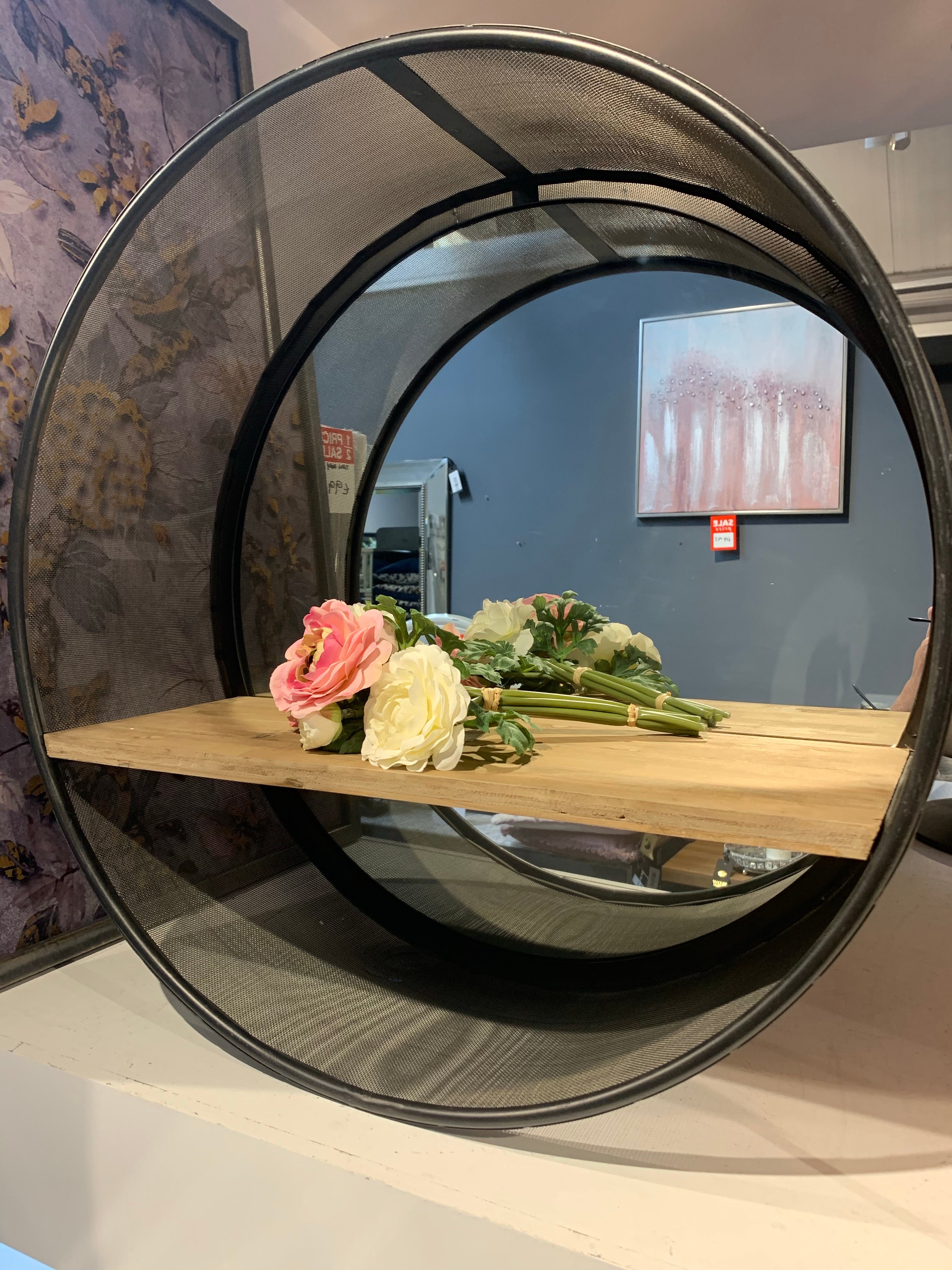 Round metal shelf unit with shelf for collection