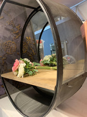 Round metal shelf unit with shelf for collection