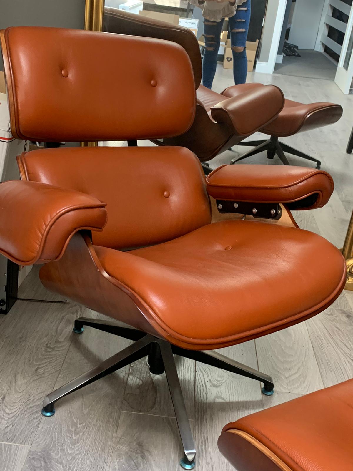 Eames Tan leather chair plus footstool warehouse clearance sold as seen pay Instore only