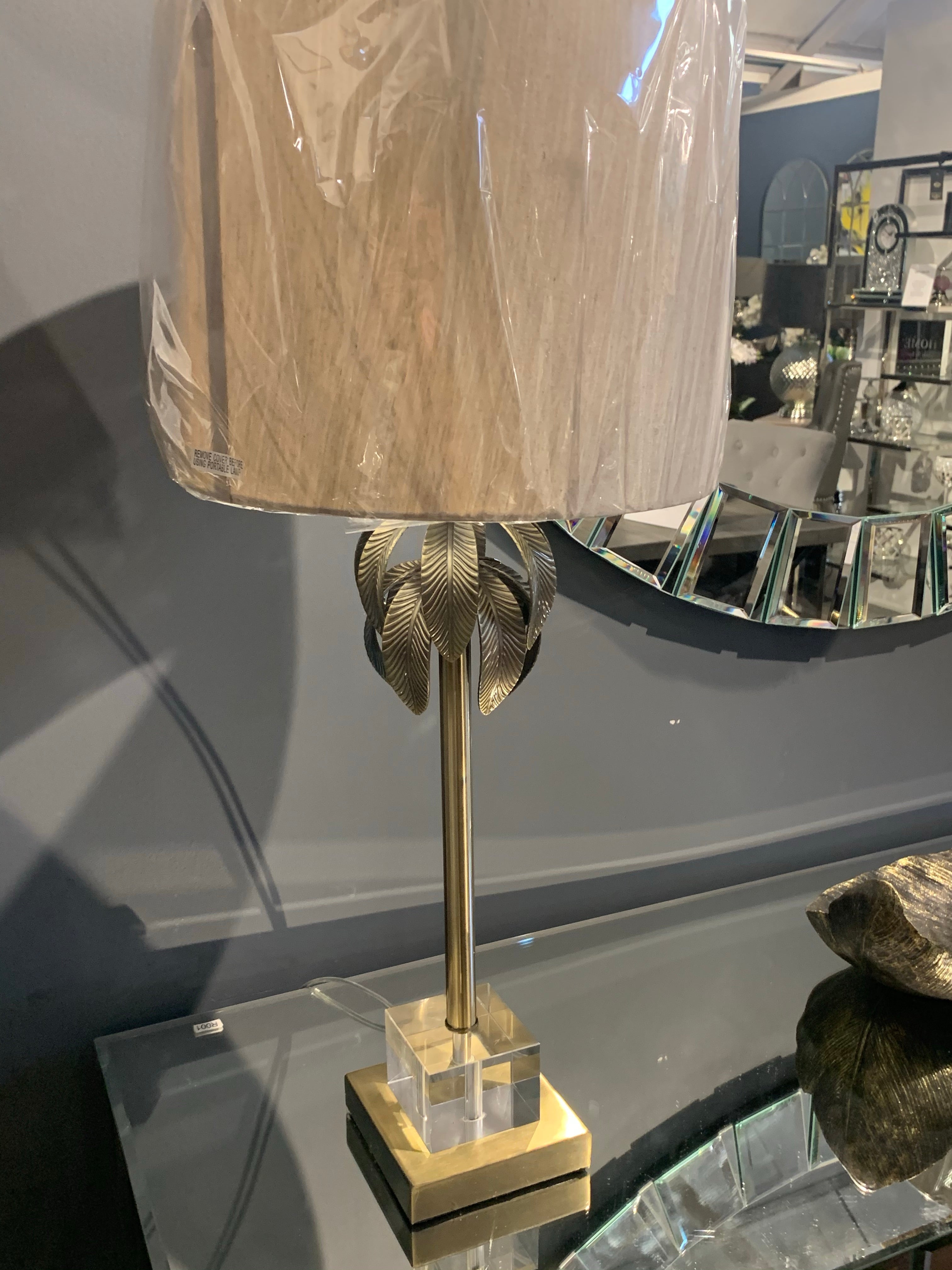 Herta table lamp with leaf design on antiqued brass  base