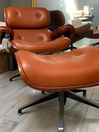 Eames Tan leather chair plus footstool warehouse clearance sold as seen pay Instore only