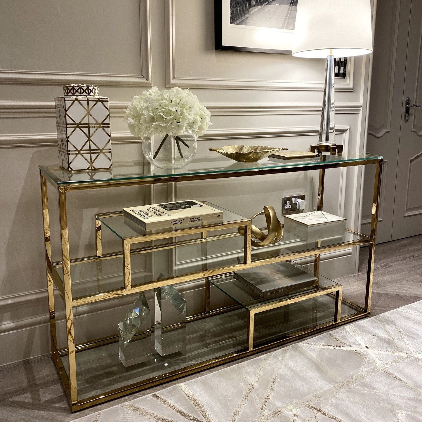 Harry chrome and glass console table with tiered shelf.